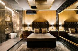Elegance suite with gold decorations at brothel Felina Barcelona